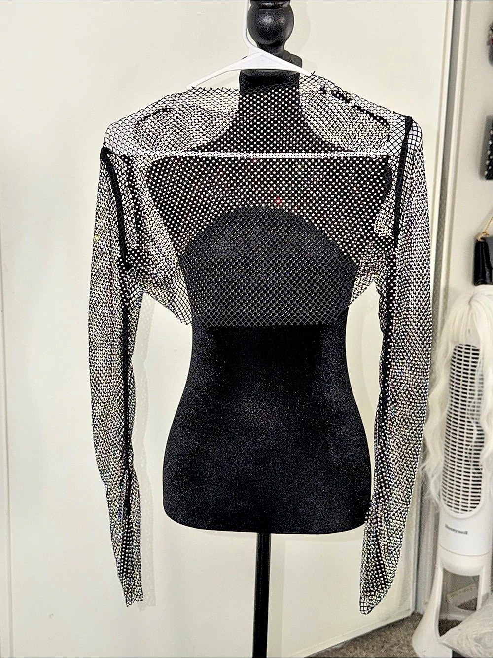 Long Sleeve Rhinestone Mesh Crop top . The rhinestones shine in different colors